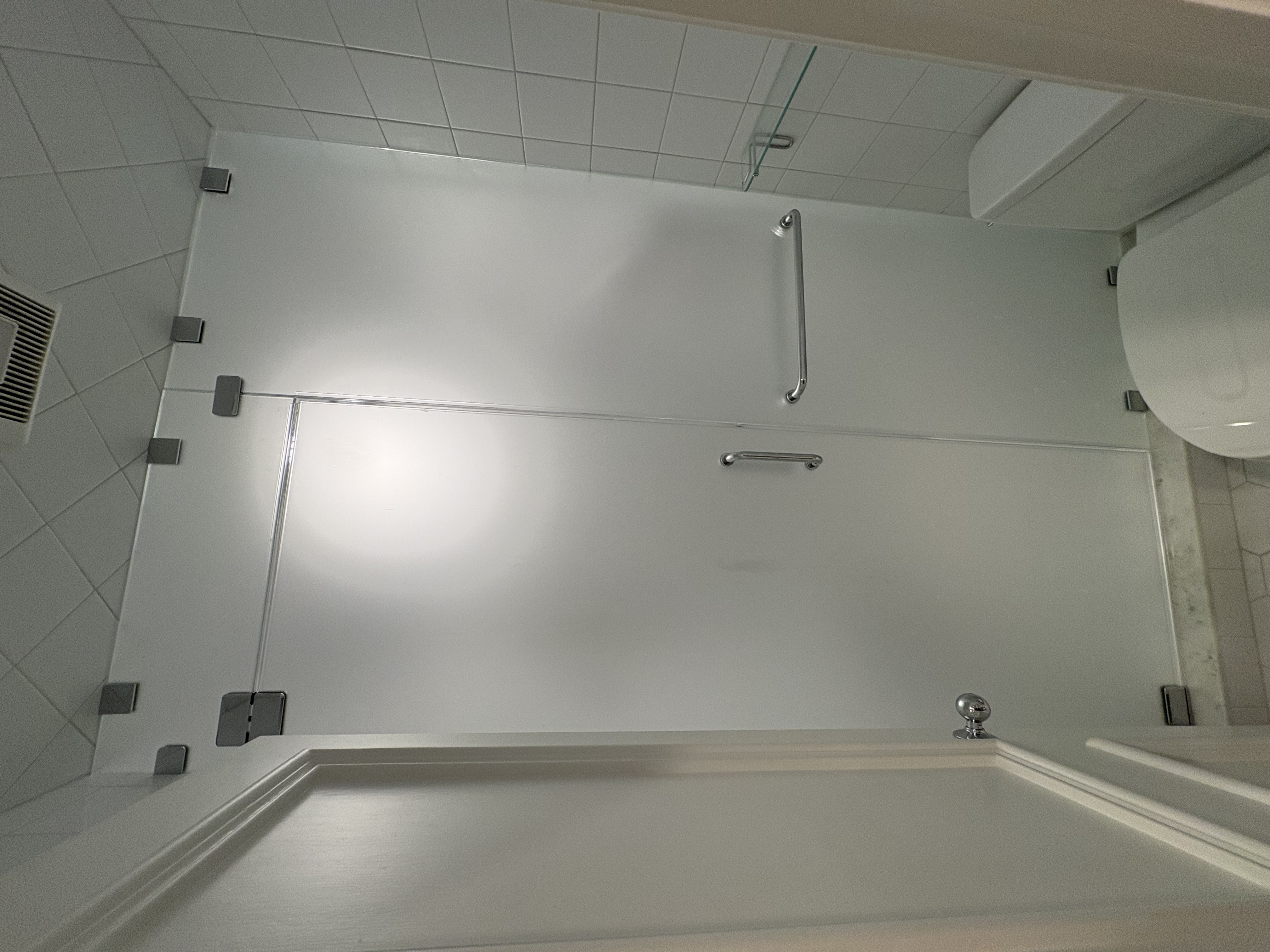 This is a satin glass steam enclosure with a transom and towel bar!