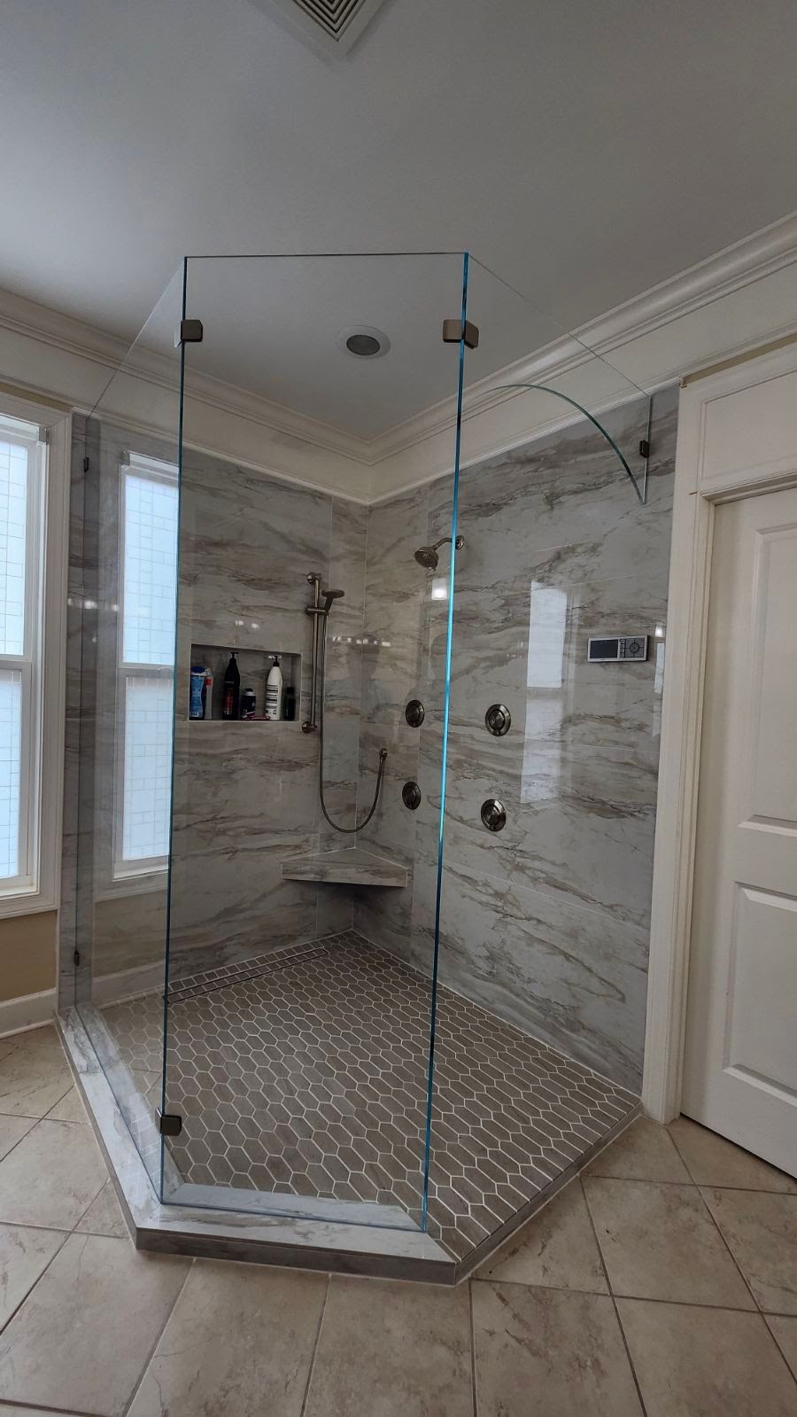 This arched transom doorway was a beautiful made custom piece of low iron glass to support the freestanding panels. What a beautiful design!