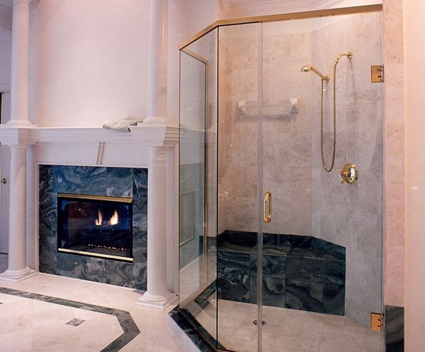 Neo-Angle Shower. This beautiful bathroom has a large shower enclosure and incorporates use of a header to support the glass panels. Door mounted in wall. Most headers allow for a pivot hinge mounted for flexible design options. See other Neo-angle picures.