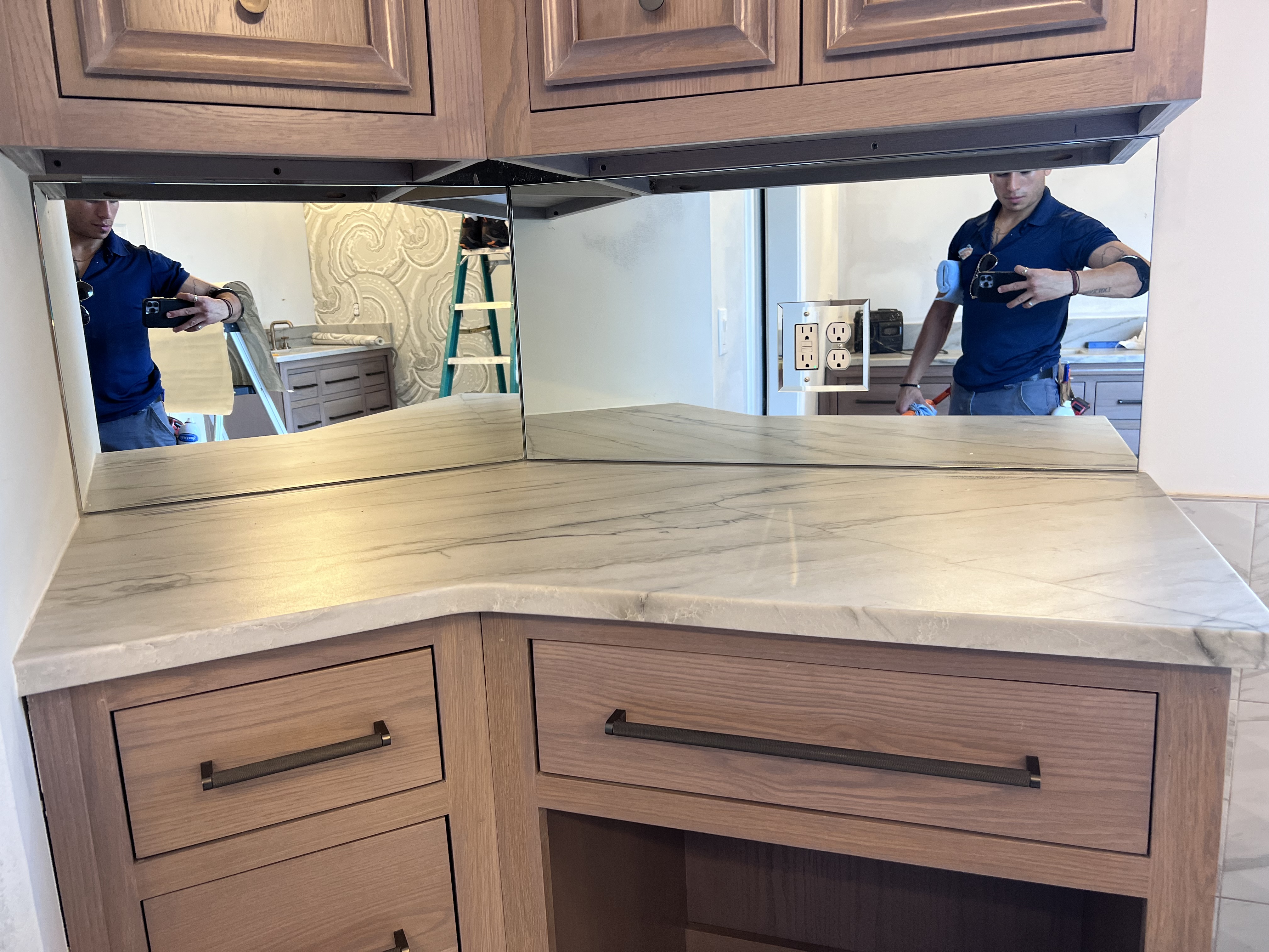 This mirror is a backsplash in a remodeled kitchen!