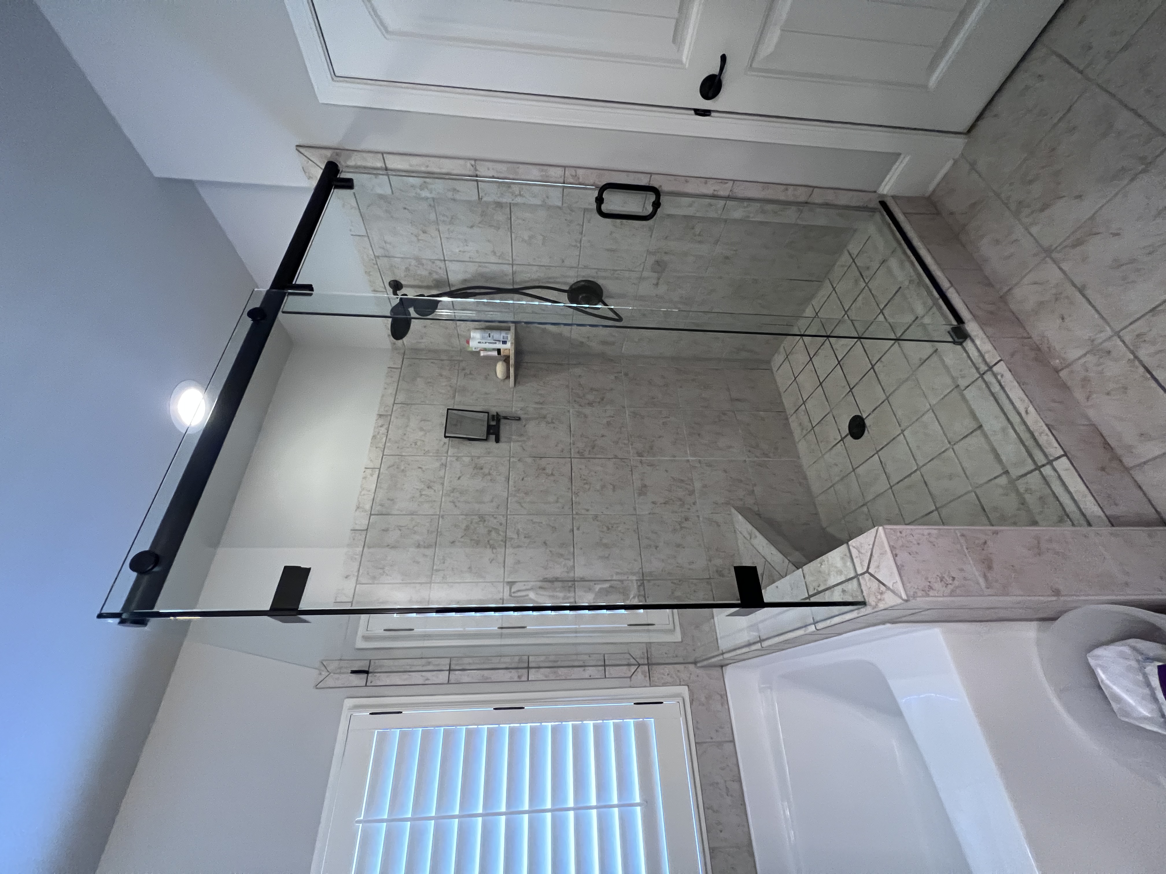 This shower is called a Hydroslide and allows for a corner return panel!