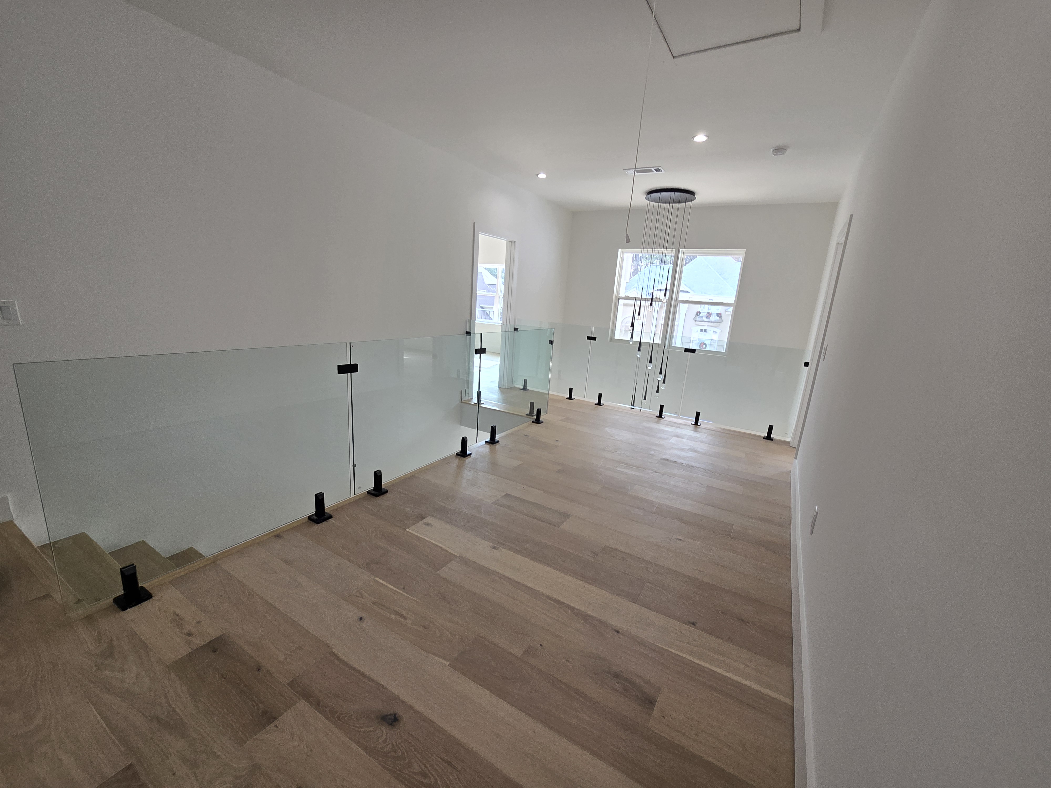 A glass railing helps too show off the beauty of the room