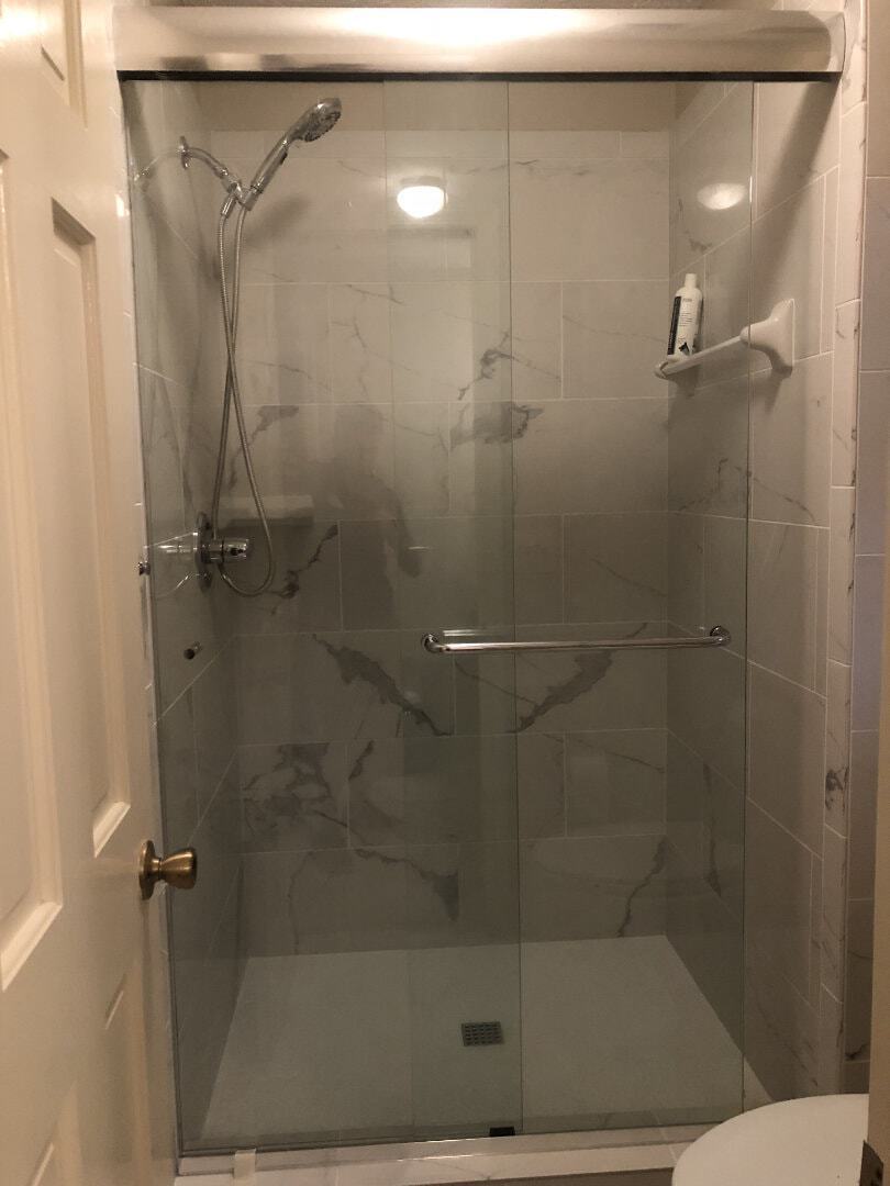 This is called a Cottage Slider which includes one towel bar and one handle. Note that it is considered one of our premier frameless sliding options as it does not require wall jambs for stability!