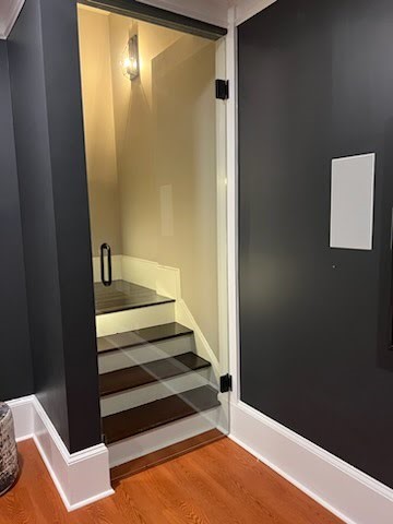 This basement door was designed with a "man cave" in mind to keep the noise down while watching sporting events or hosting parties! While glass is not sound proof, it can certainly help dampen the ruckus while looking beautiful!