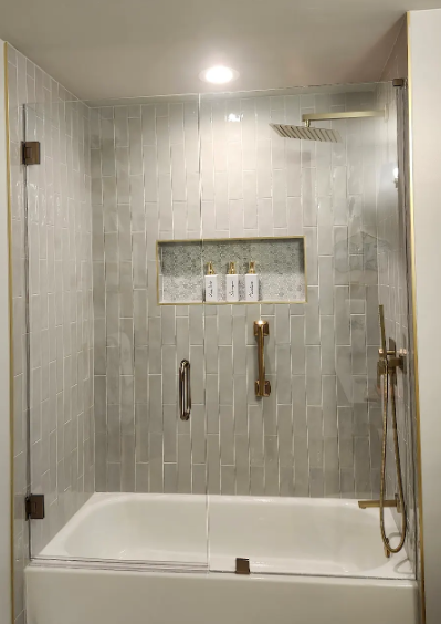 This is a brushed bronze door and panel on a tub. The door swings both inwards and outwards!